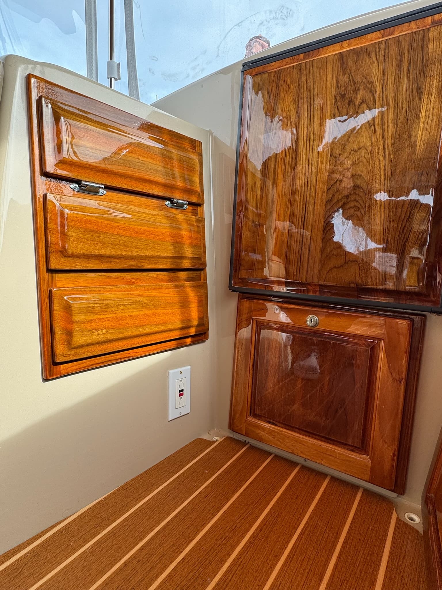 Electric boat brightwork restoration — gloss finish
